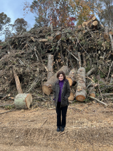 Commissioner Loomis in front of a large debris pile