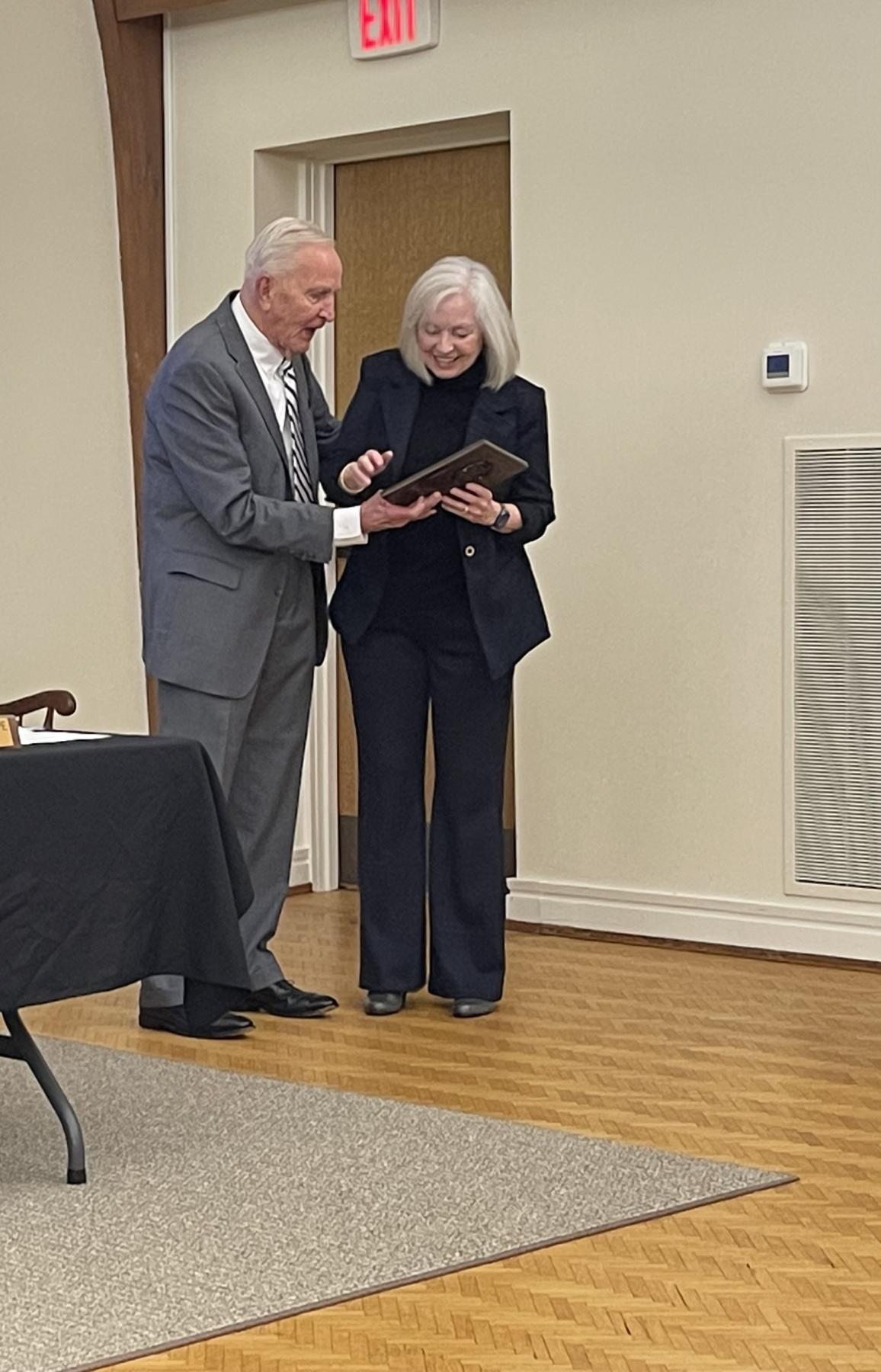 Former Commissioner Fran Cogburn receiving her plaque for her dedication to The Town. 