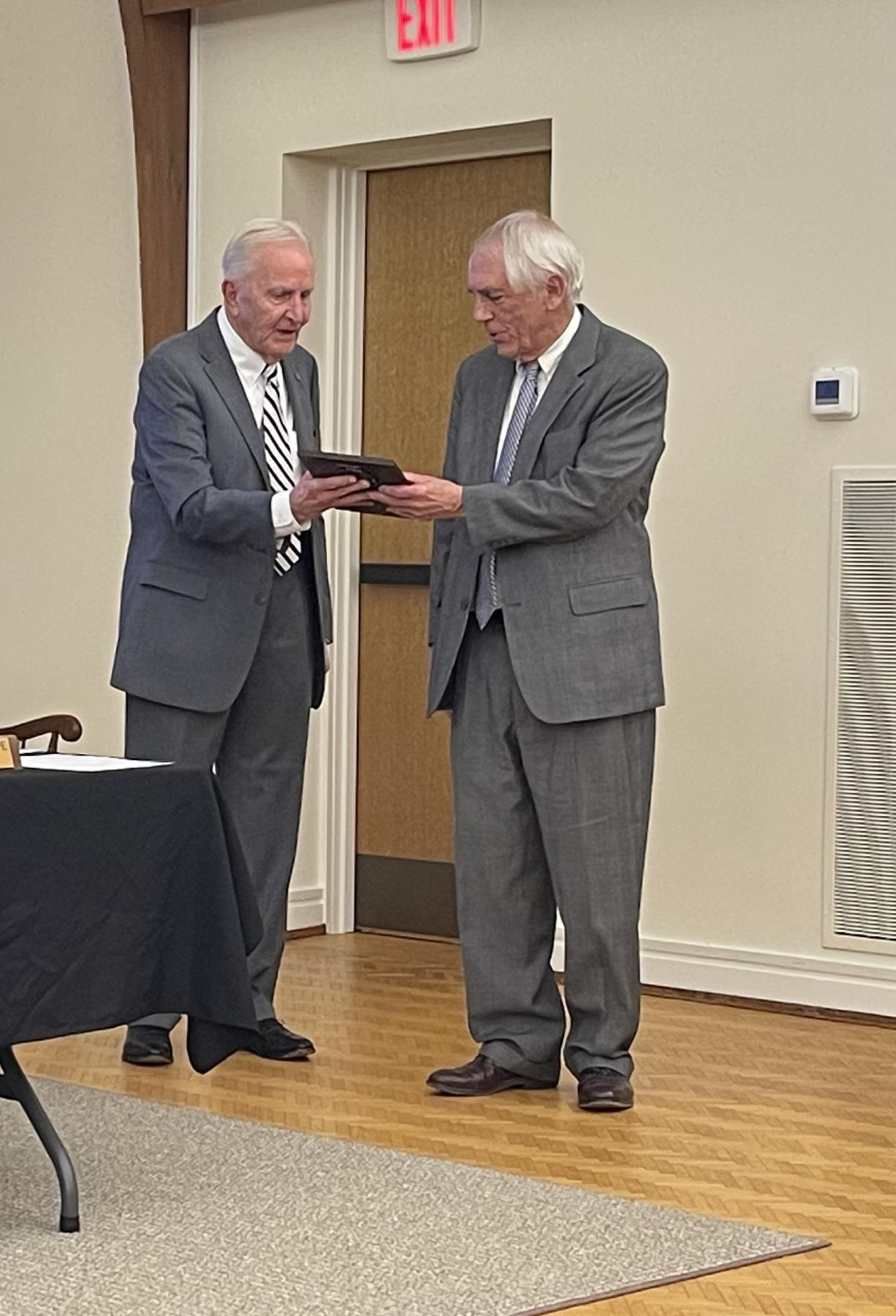 Former Commissioner Glenn KellyFran Cogburn receiving his plaque for his dedication to The Town.